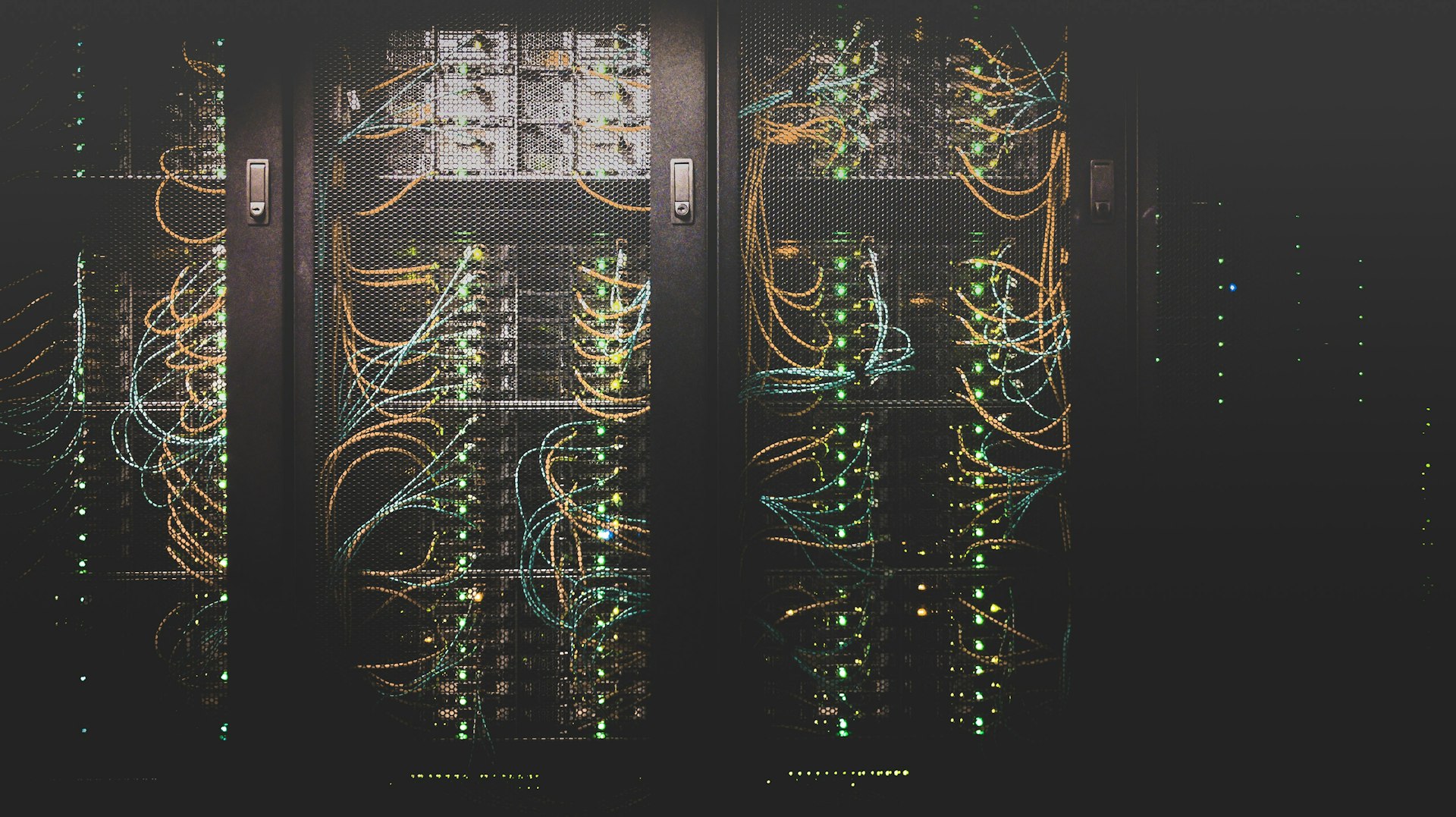 Data centre racks with servers running under cool blue light